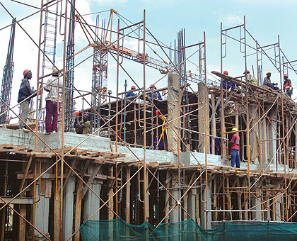 Workers on a proposed new hotel in Kigali. The New Times / File.