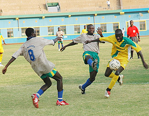 Policeu2019s Alimansi Kadogo (right), seen here in action for his former club Atraco against Marines in the last game of the 2009 season that ended 0-0. The Ugandan midfielder will be hoping for a change in fortune on Saturday. The New Times/File.
