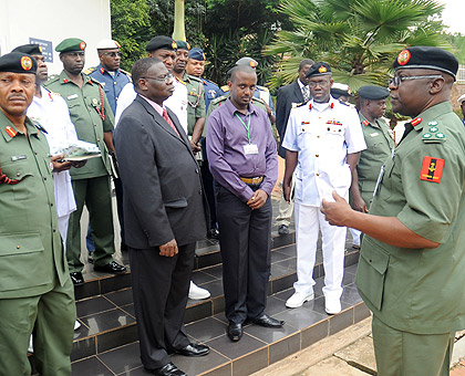 Nigerian Army delegation led by Brig. Gen. Yushau Mahmood Abubakar (R) at Kigali Genocide Memorial Centre yesterday. The New Times / John Mbanda.