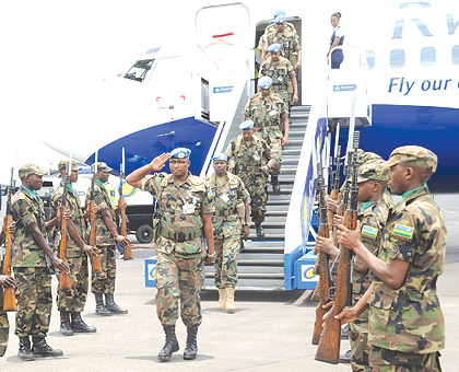 RDF soldiers returning from a peacekeeping mission. The New Times / File.