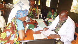 An RDF doctor attends to a patient at Munini hospital last monday. The New Times / JP Bucyensenge.