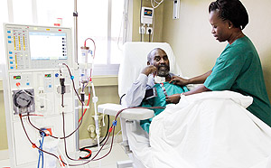 A nurse tends to a patient at King Faysal Hospital. The affiliation of parents on medical insurance is still under debate. The New Times / File