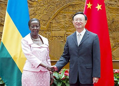 Chinese Foreign Minister Yang Jiechi (R) shakes hands with Rwandan Minister of Foreign Affairs and Cooperation Louise Mushikiwabo in Beijing, capital of China, May 22   (Xinhua)