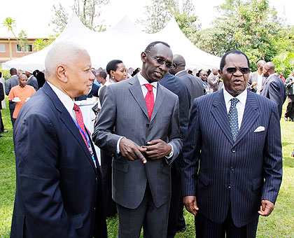 L-R: Chief Justices Mohamed Chande Othman of Tanzania, Prof Sam Rugege of Rwanda and Benjamin Odoki of Uganda share a light moment at a regional magistratesu2019 meeting in Kigali yesterday. The New Times / Timothy Kisambira.