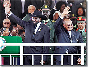 Salva Kiir (L) and Omar Bashir acknowledge cheers during South Sudanu2019s independence day. Net photo.