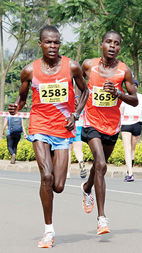 Paul Kosjei (2583) led a 1-2-3 finish in the 42km race after clocking two hours, 14 minutes and 56 seconds. The New Times /T. Kisambira.