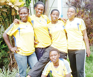 Rwanda Beach Volleyball national Team players pose for the cameras before the continental tournament. The New Times / Peter Kamasa.