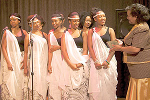 Sweden-based Imanzi Youth Troupe receives an award from the Dean of Africa Heads of Mission in Sweden, Ambassador Bernadette Sebage Rathedi of Botswana. Photo by Luc Gatwa.