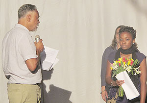 La Fille du Grand Monsieur director Georges Kamanayo congratulates Marie Dusabe Jambo for winning the contest. 