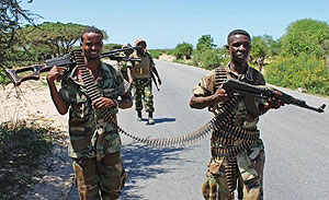Somali soldiers patrol a stretch of road betwwen Mogadishu and Afgoye on May 25. Xinhua.