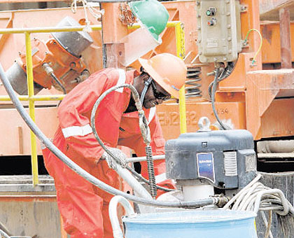 Workers at the Ngamia 1 oil rig in Turkana county, Kenya. Net photo.
