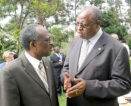 The Executive Secretary of the Regional Centre on Small Arms (RECSA), Francis K. Sang (R), with his deputy Amb. Tharcisse Midonzi at a meeting in Kigali yesterday. The New Times / John Mbanda.