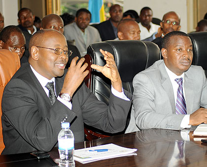 Local Government Minister James Musoni (L) and PS Cyril Turatsinze (C) during their appearance before the Parliamentary Standing Commitee on Budget yesterday. The New Times / John Mbanda.