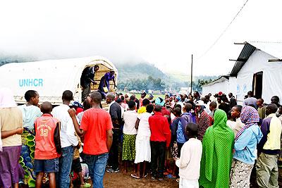 Refugees disembark from a UNHCR vehicle at Nkamira refugee camp on their arrival from DRC. The Sunday Times / File.