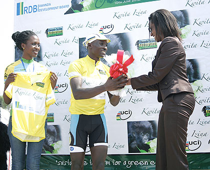 Riding for baby gorillas. Rwandau2019s Abraham Ruhumuriza is congratulated by the Head of Tourism and Conservation at Rwanda Development Board, Rica Rwigamba upon winning this yearu2019s Kwita Izina International Cycling Tour yesterday.The New Times / Courtesy.