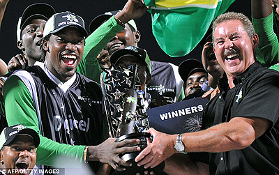 Allen Stanford (right) poses with Stanford Superstars in 2008. Net photo.