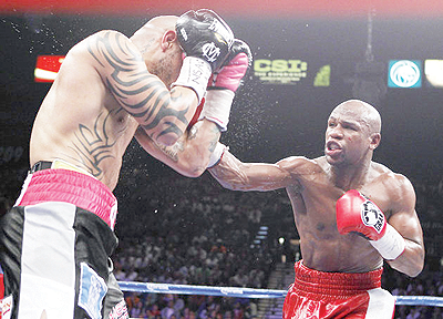 Mayweather (right) vs Cotto (left) fight generated $94 million in PPV receipts. Net photo.