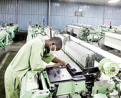 A worker in a textile factory. The textile industry was meant to be among the main beneficiaries of AGOA. The New Times / File.