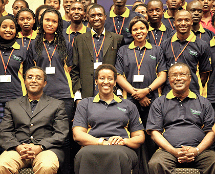 First Lady Jeannette Kagame (C), together with the Minister of Education, Dr Vincent Biruta (L), and the UN Resident Coordinator/UNDP Resident Representative in Kigali, Opia Mensah Kumah, in a group photo with the students yesterday. The New Times / Timot