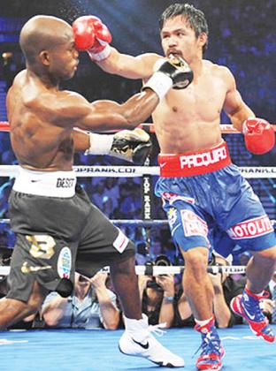 Manny Pacquiao outlanded Timothy Bradley in 10 of 12 rounds, yet two of three judges awarded the win to the American fighter. Net photo.