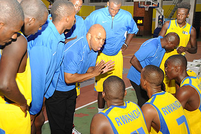 Coach Nenad Amanovic (C) talks to his players during time-out during the 2010 Zone V qualifiers also held in Kigali, which was won by Egypt. The New Times / File.