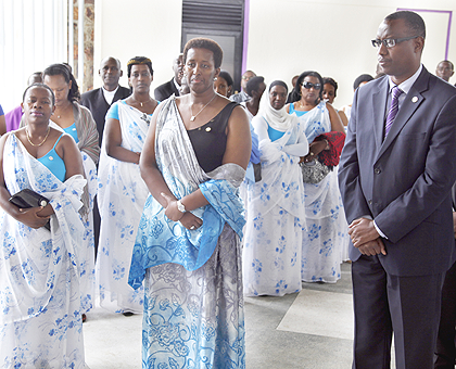 First Lady, Mrs Jeannette Kagame (C) together with the Minister of Sports and Culture Protais Mitali,(R) National Bank of Rwanda Vice Governor (L), Monique Nsanzabaganwa, and members of the Unity club at Cyanika Memorial center. The Sunday Times / Timothy