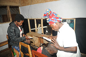Daphroza Uwineza,  a Congolese refugee, operates a hair salon in Gihembe Refugee Camp. The New Times / The New Times / J. Mbanda.