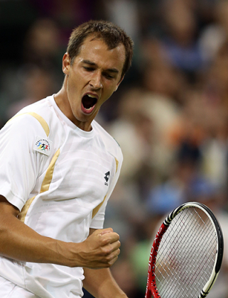 Lukas Rosol of the Czech Republic celebrates his historic victory. Net photo.