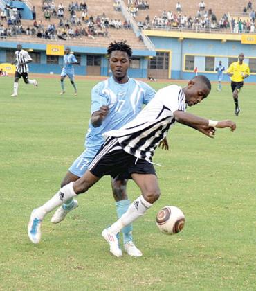 APRu2019s midfielder Jean Baptiste Mugiraneza being challenged by Police striker Andre Lomami during last year's Peace Cup final, which APR won 4-2. The New Times/File.