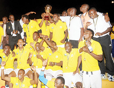 APR players and officials celebrate yesterday MTN Peace Cup final win over Police FC. APR won 2-1 in extra time courtesy of Olivier Karekeziu2019s goal. The New Times/J. Mbanda.
