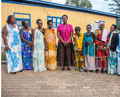 The First Lady Jeannette Kagame (C) with AVEGA AGAHOZO members. The New Times / Robyn Spector.