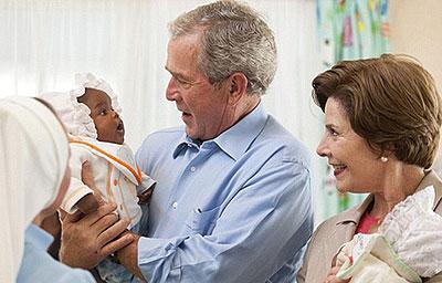 Former President George W. Bush and former First Lady Laura Bush visited Bostwana. The saddest thing of all is to know a lady's life has been saved from AIDS but died from cervical cancer, Bush said in a statement. Net photo.