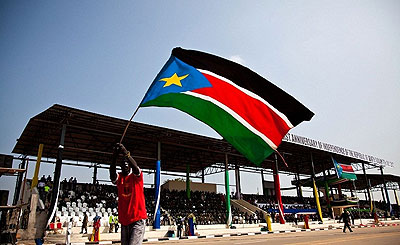 A man waves a flag during the celebration to mark one year of independence of South Sudan yesterday. Net Photo.