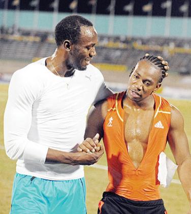 Jamaica's training partners Usain Bolt (L) and Yohan Blake (R) will provide the highlights at the London Olympic Games. Net photo.
