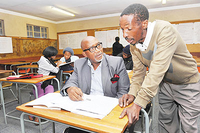A teacher attends to 60-year-old Mabuse. Net photo.