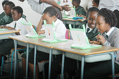 Kids learning computers provided by the One Laptop per Child Project. The New Times / File.