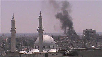 Smoke rises from Juret al-Shayah in Homs July 11, 2012. Net photo.