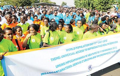 Youth marched from Parliament to Amahoro Stadium to mark world population day on Wednesday. The Sunday Times / John Mbanda.