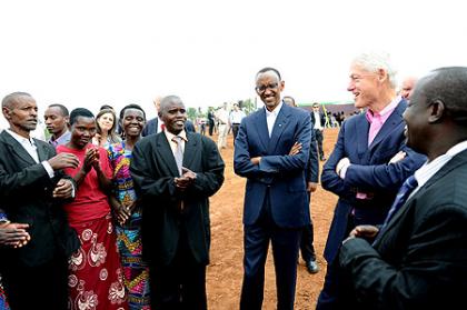 President Kagame and President Clinton speaking with soy farmers at Mt. Meru Soyco Plant. Kayonza, 19 July 2012