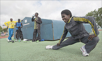 Rwandan runners, Mukasakindi (R), Robert Kajuga (C) and Mvuyekure (L), along with their coach Innocent Rwabuhihi at Bury St Edmunds' training complex. Net photo.
