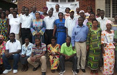 Some of the men and women who have benefited from Aspire, pose with staff members. The Sunday Times / Grace Mugoya