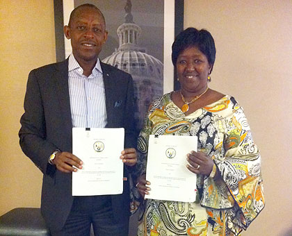 Ambassador Kimonyo (L) and Minister Binagwaho displaying the MoU. The New Times / Courtesy.