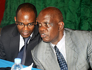 Umwalimu Sacco Chairman Jean Marie Vianney Nzagahimana (R) with Managing Director Joseph Museruka during this year's General Assembly. The New Times / John Mbanda.