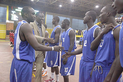 LEFT: Junior Hoops captain Pascal Karekezi introduces his teamates to Sports Minister Protais Mitali.