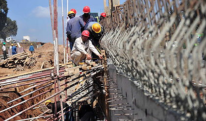 Road construction in progress at the Nairobi-Thika road in. A survey has showed that Africa has managed to sustain its economic recovery amid global recession. Xinhu / photo