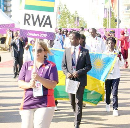 Chef de Mission Serge Mwambali leads Team Rwanda to the welcome ceremony which was held in the Londonu2019s Olympic Village on Tuesday. The New Times/Courtesy.