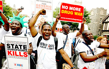 A demonstrator(s) holds a placard during the AIDS Parade in Washington D.C. on July 24, 2012. Net photo.