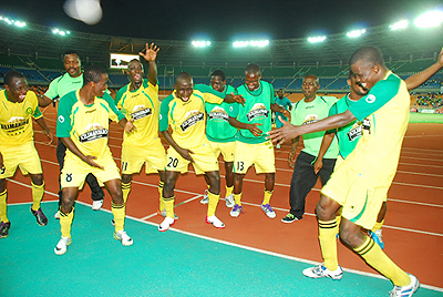 Amavubi's Haruna Niyonzima leads Yanga in celebrations after winning the 2012 Cecafauf022Kagame Cup title yesterday.