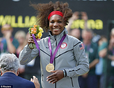 Serena Williams beams after collecting her gold medal. Net photo.