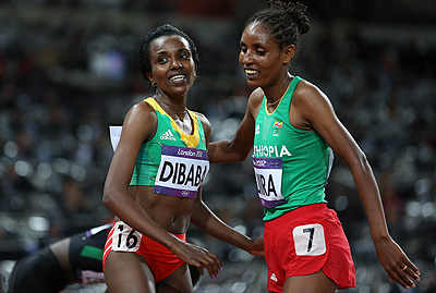 Tirunesh Dibaba (L) becomes the first to win back to back Olympic titles over the distance. Net photo.
